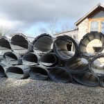 Fibreglass ribbed roofing sheets rolled and ready.